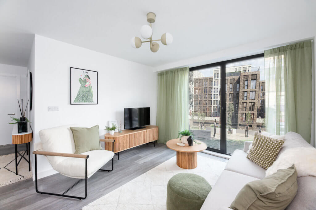 Spacious living area featuring large windows and stylish décor in Berkeley Square apartment