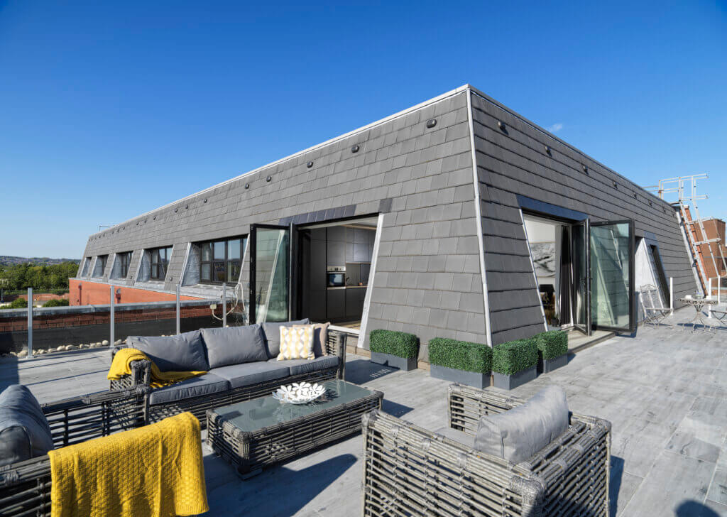 A photo of the penthouse outdoor space with a beautiful blue sky